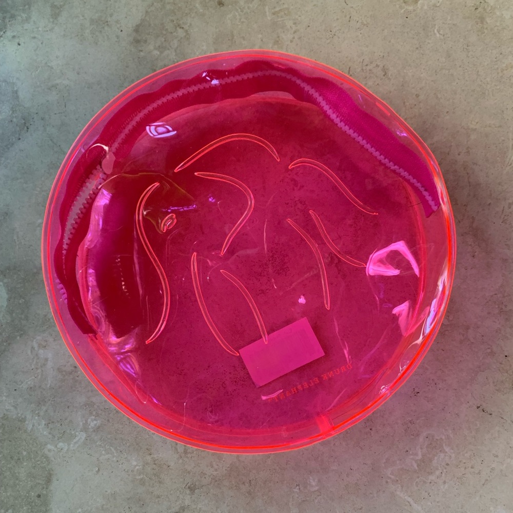 Drunk Elephant Neon Pink round makeup bag